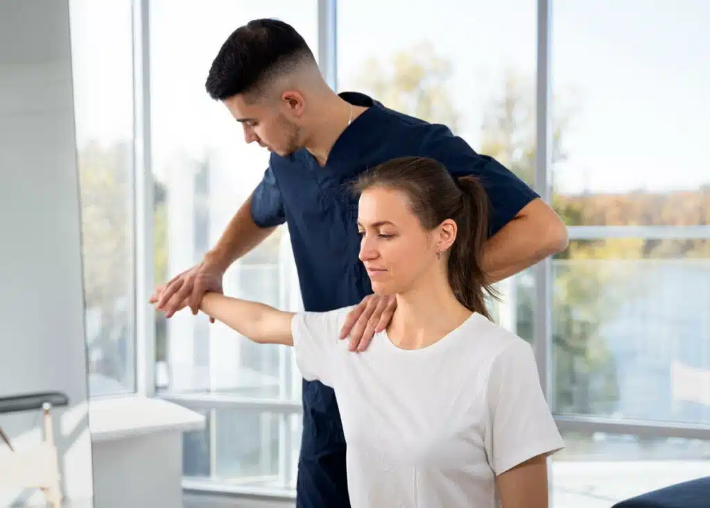 Woman having some Fibromyalgia treatment session with a chiropractor in the clinic