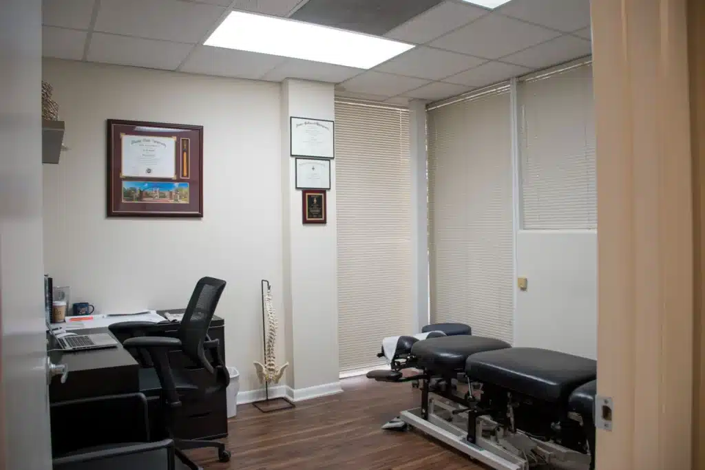 Chiropractic clinic interior showcasing patient care spaces