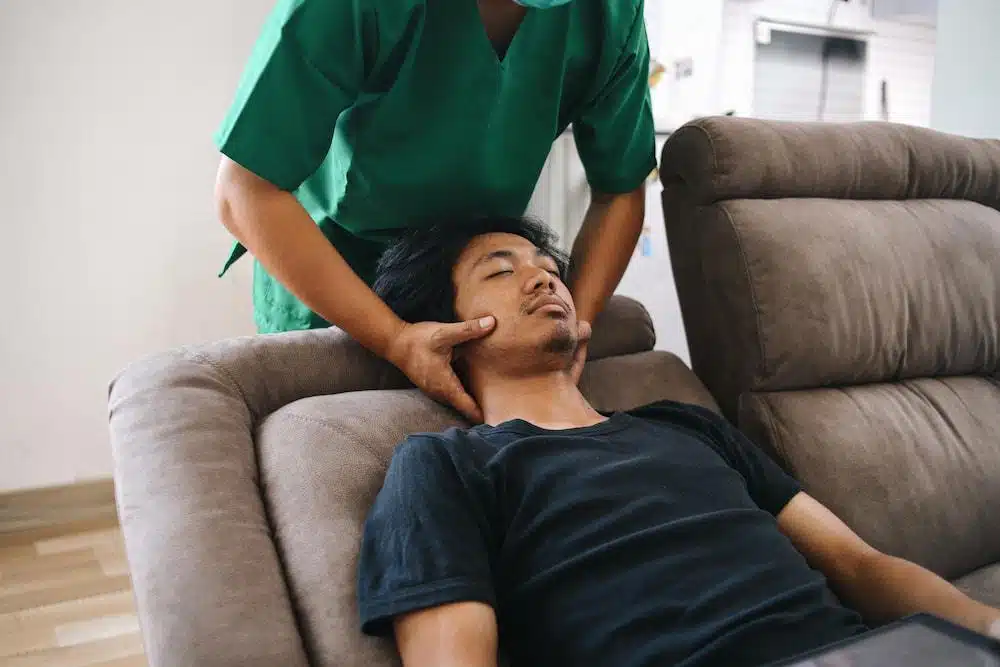 Man having some massage treatment session in a chiropractic clinic