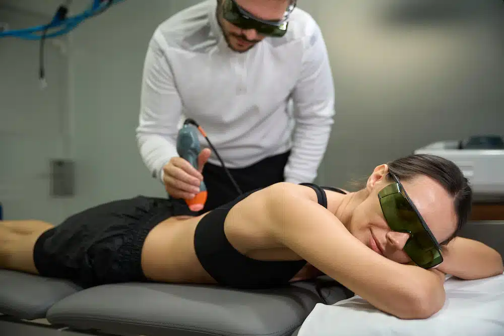 woman receiving ultrasound waves to generate deep heat for sciatica treatment