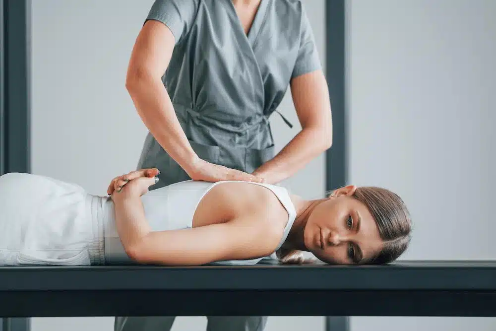 Patient having some Scoliosis treatment in a chiropractic clinic