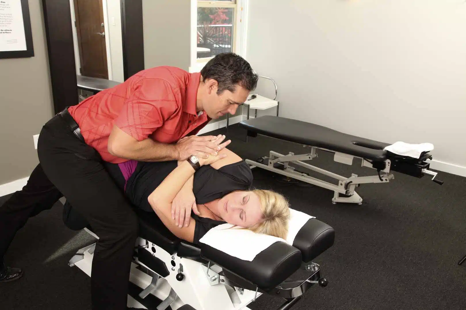 A woman having a chiropractic care